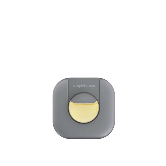Gray and yellow device with 'simplehuman' branding on a white background