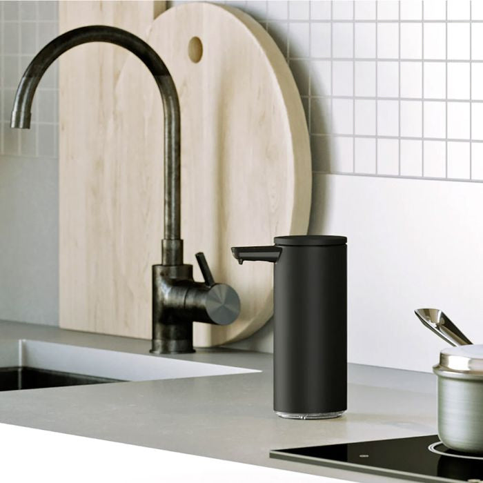 simplehuman Rechargeable Sensor Soap Pump-Black kitchen faucet and soap dispenser on a modern kitchen counter.