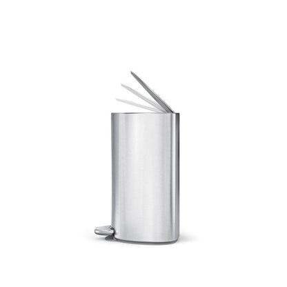 Metallic trash can with a foot pedal on a white background