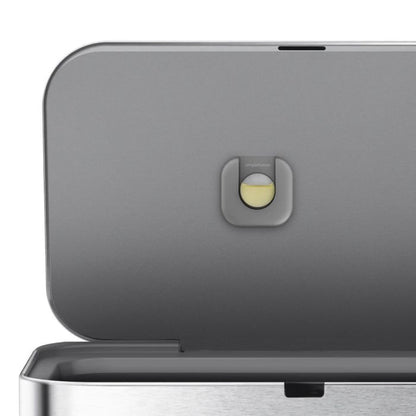 simplehuman Voice and Motion Sensor Bin, Rectangular-Close-up of a metallic appliance with a button on a white background