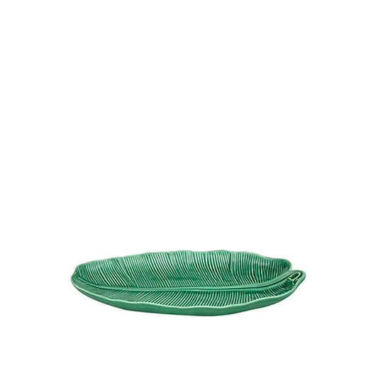 Green leaf-shaped plate on a white background