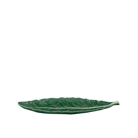 Green leaf-shaped ceramic plate on a white background