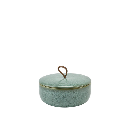 Green ceramic jar with a lid on a white background