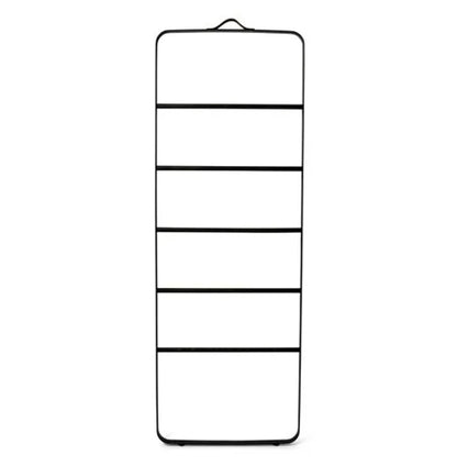 A black towel ladder with a leather strap at the top, featuring a minimalist design with several compartments.